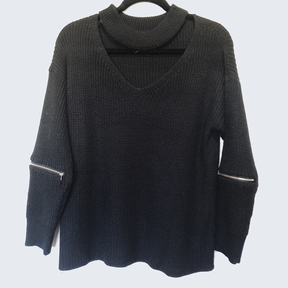 Woman’s black sweater